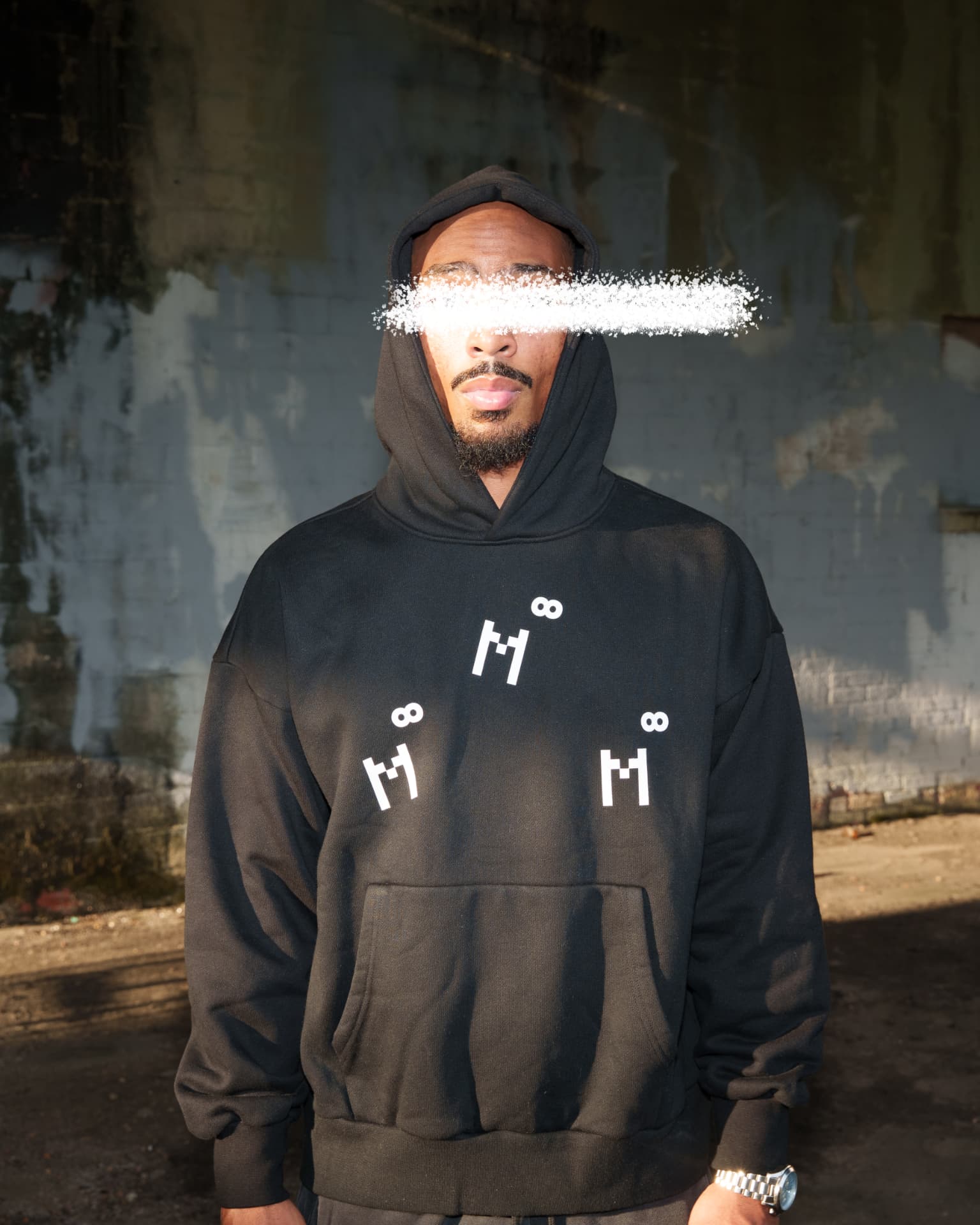 Multidimensional black hoodie with white M infinity marks